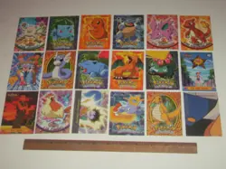 18 Topps 1999 Pokemon trading cards & stickers, Charmander Charmander Charizard - Image 1
