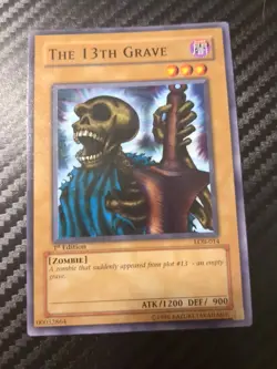 The 13th Grave LOB-014 The Legend of Blue Eyes White Dragon 1st Edition - Image 1