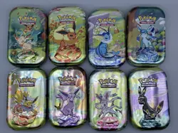 Prismatic Evolutions - EMPTY - Mini Tin Complete Set Of 8 (Tin + Card + Coin) - Image 1