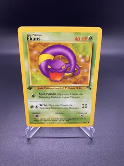 1st Edition Ekans 46/62 Fossil WOTC Pokemon Card 1999. LP - Image 1