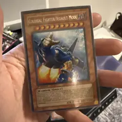 Yu-Gi-Oh! TCG Secret Rare Colossal Fighter/Assault Mode CRMS-EN000 Near Mint - Image 1