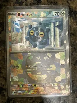 Pokemon TCG Bronzor Master Ball Pattern Card 066/131 Prismatic Evolutions - Image 1