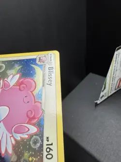 Pokemon TCG SM Lost Thunder Blissey 153/214 Cosmos Holo Promo SWIRL Small Dent - Image 4