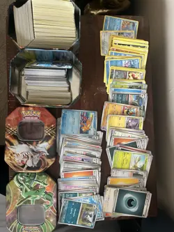 Assorted Pokemon Card Collection + 2 Collector’s Tins (Resharam & Rayquaza) - Image 1