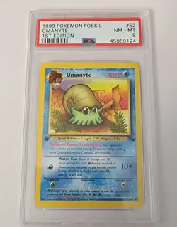 1999 POKEMON FOSSIL 1ST ED #52 OMANYTE PSA 8 - Image 1