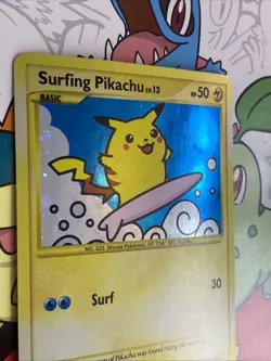 2009 Pokemon Rising Rivals Surfing Pikachu 114/111 Secret Rare Holo SWIRL NM - Image 3