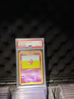 1999 Pokemon Fossil First Edition Slowpoke PSA 7 - Image 1