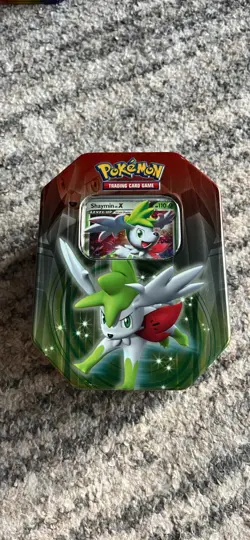 2009 POKEMON TCG SHAYMIN LV.X IN COLLECTOR’S TIN (OPENED BUT IN GOOD CONDITION) - Image 1