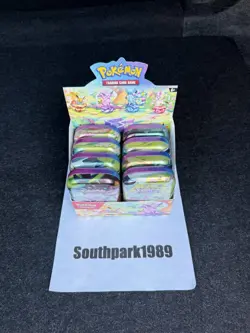 Pokemon TCG: Prismatic Evolutions Full Set Of 8 Sealed Mini Tins With Display - Image 1