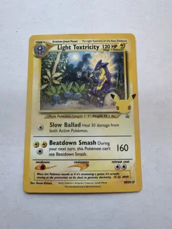 Pokemon: Light Toxtricity SWSH137 Celebrations Black Star Promo Card - Image 1