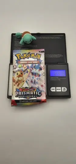 Pokemon TCG Prismatic Evolutions HEAVY pack Sealed Booster Pack (23.18g) - Image 1