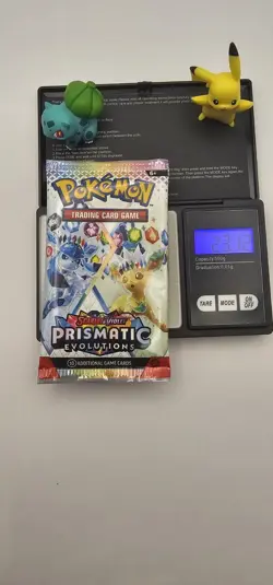 Pokemon TCG Prismatic Evolutions HEAVY pack Sealed Booster Pack (23.12g) - Image 1