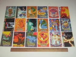 18 Topps 1999 Pokemon trading cards. Charmander, Charmelean, Meowth - Image 1