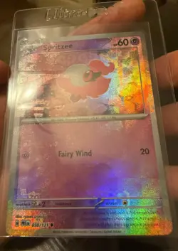 Spritzee (Poke Ball Pattern) 038/131 Sv: Prismatic Evolutions Holo Texture Shift - Image 1