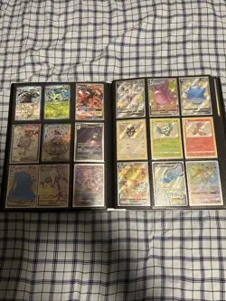 Pokemon cards in pokemon binder. - Image 1