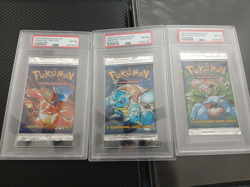 Three 1999 Pokemon Base Set Booster Packs - Charizard, Blastoise, Venusaur PSA 8 - Image 1