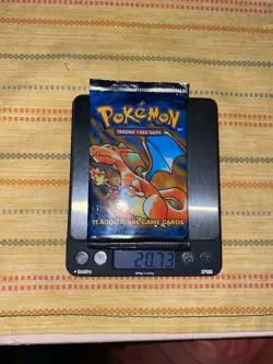 Pokemon Base Set Sealed Booster Pack Charizard Art Auction Starts at 88 Cents - Image 1