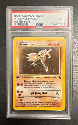 1999 POKEMON FOSSIL 1ST EDITION #7 HITMONLEE HOLO PSA 9 - Image 1