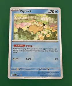 Pokemon TCG - Mega Evolutions - Psyduck - 007 - Cosmos Holo - Black Star - Image 1