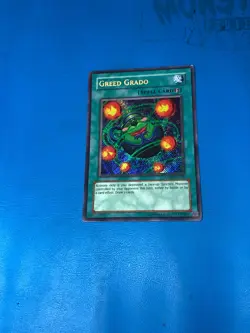 YUGIOH Secret Rare Greed Grado ANPR-EN088 PLAYED - Image 1