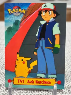 1999 Topps Pokemon Series 1 #TV1 Ash Ketchum (TV Animation Edition) Blue Logo LP - Image 1
