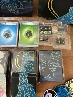 2025 Pokemon TCG Misc Lot- Card Sleeves, Prismatic Figurine, Tins, Dice, Energy - Image 3