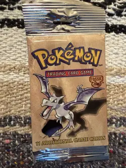 Open with cards fossil 1999 pokemon base set pack. (Unused) - Image 1