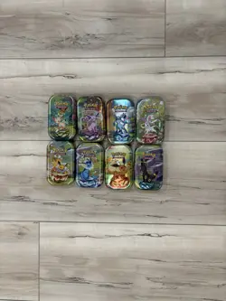 8x Pokemon Prismatic Tin Collection Including Art & Coins (No Cards) - Image 1