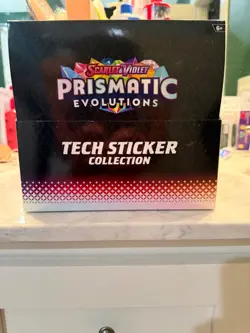 *NEW* Pokemon TCG Prismatic Evolutions Tech Sticker Collection Box Case of 12 - Image 1