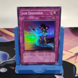 Jam Defender RP02-EN036 Retro Pack 2 Unlimited Super Rare Yugioh TCG - Image 1
