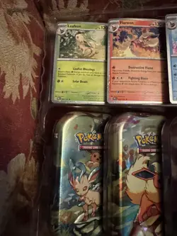 Prismatic Evolutions Mini Tins Full Set Of 8 w/Art Cards Coins & PromosNo Packs - Image 2
