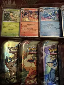 Prismatic Evolutions Mini Tins Full Set Of 8 w/Art Cards Coins & PromosNo Packs - Image 3