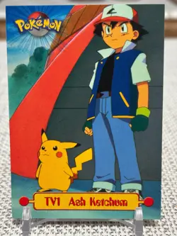 1999 Topps Pokemon Series 1 #TV1 Ash Ketchum (TV Animation Edition) Black NM - Image 1