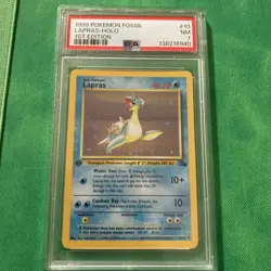1999 Pokemon Fossil 1st First Edition Lapras 10/62 Holo PSA 7 NM - Image 1