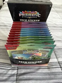 Pokemon TCG Prismatic Evolution Tech Sticker Collection 12ct Display Case - Image 1