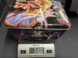 Pokemon Card Bulk Lot in Metal Tin - Random Cards w/ Some Holos Shown. 3lbs - Image 1