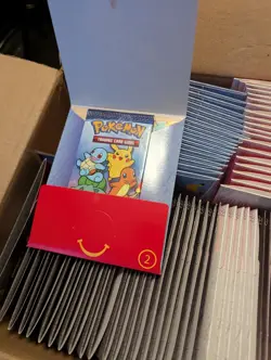 100 SEALED PACKS OF MCDONALDS 25TH ANNIVERSARY POKEMON CARDS PERFECT CONDITION! - Image 1