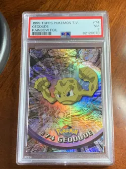 1999 Topps Pokemon TV #74 Geodude Rainbow Foil Black Logo PSA 7 Near Mint - Image 1