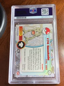 1999 Topps Pokemon TV #74 Geodude Rainbow Foil Black Logo PSA 7 Near Mint - Image 2