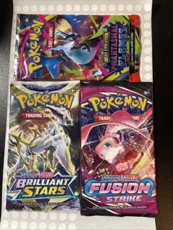 3 Pokemon Booster Packs (Phantasmal Flames, Brilliant Stars, Fusion Strike) - Image 1
