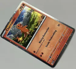 Pokemon Paldean Fates Charmander Basic Promo Cosmos Holo #007/091 - Image 2