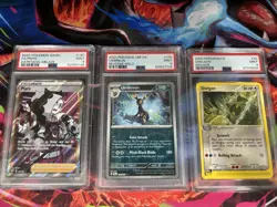 2020 POKEMON PIERS 2023 POKEMON OBF EN UMBREON 2003 POKEMON EX SHELGON PSA 9 - Image 1