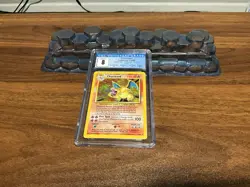 1999 POKEMON BASE SET UNLIMITED CHARIZARD CGC 8 - Image 1