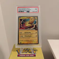 2025 POKEMON DESTINED RIVALS GAMESTOP EXCLUSIVE #070 TEAM ROCKET'S ZAPDOS PSA 9 - Image 1