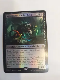 Karumonix, the Rat King Phyrexia: All Will Be One Foil - Image 1