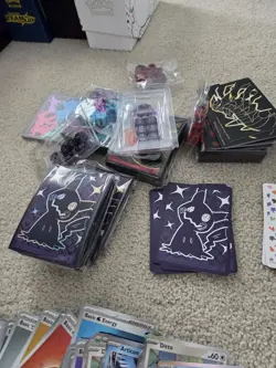 Pokemon Card Lot Featuring Commons Sleeves Player Guides and More - Image 4