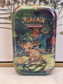 Pokemon TCG: Prismatic Evolutions Leafeon Mini Tin Factory Sealed - Image 1