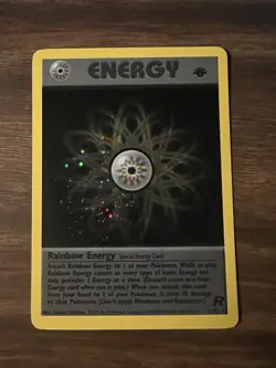 2000 Pokemon Team Rocket 1st Edition #17/82 Rainbow Energy Holo NM - Image 1