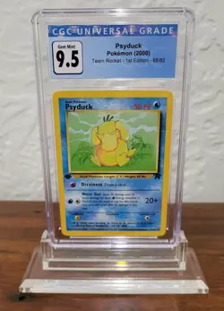 2000 Pokemon Team Rocket 1st Edition Psyduck #65 CGC 9.5 Gem Mint - Image 1