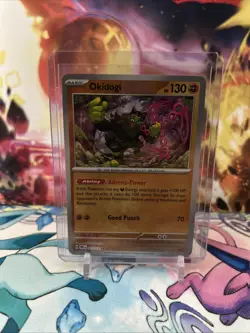 Pokemon TCG Okidogi Prismatic Evolutions Master Ball Pattern Holo Card 057/131 - Image 1
